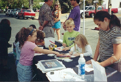 Kids coloring at the Merced Art Festival